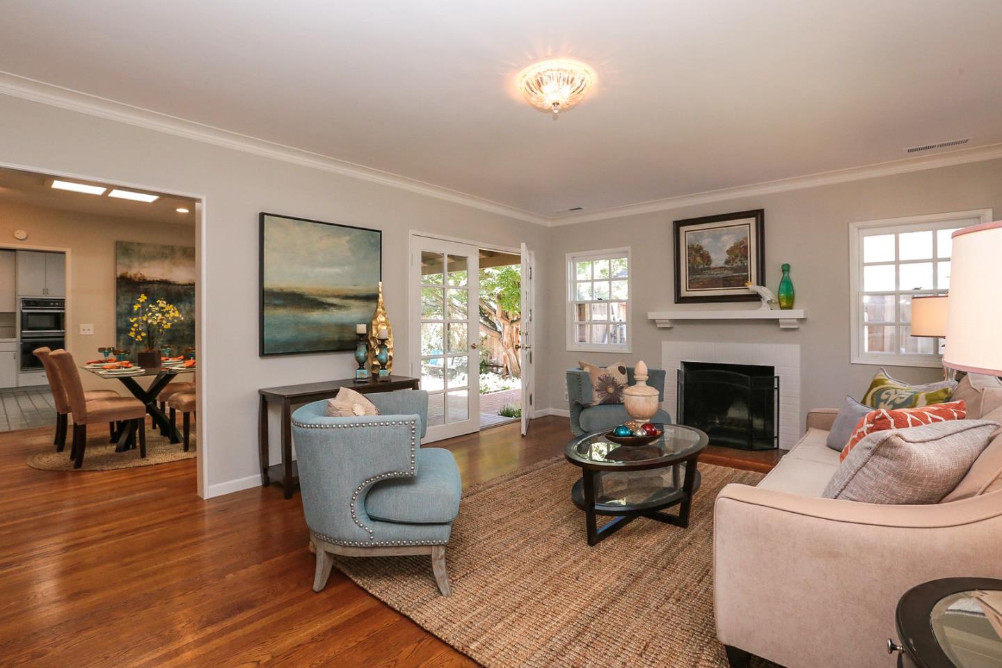 2160 Middlefield Road Palo Alto, CA 94301 - Photo 5 of 24 a living room with furniture a fireplace and a flat screen tv