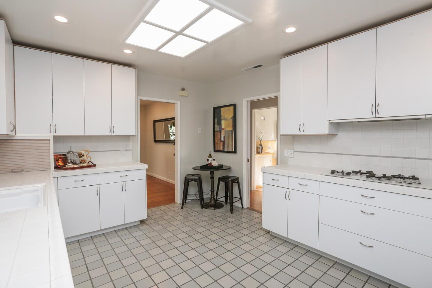 2160 Middlefield Road Palo Alto, CA 94301 - Photo 10 of 24 a kitchen with cabinets and window