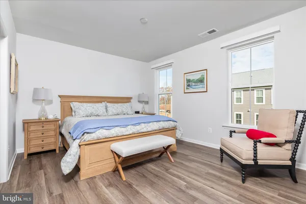 a bedroom with a bed and a dresser