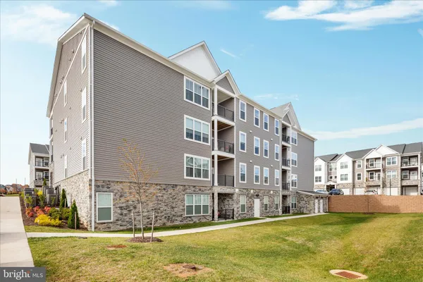 a view of building with a swimming pool