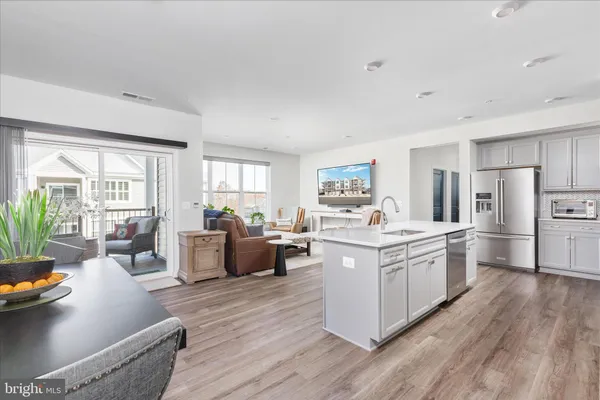a open kitchen with stainless steel appliances a lot of counter top space