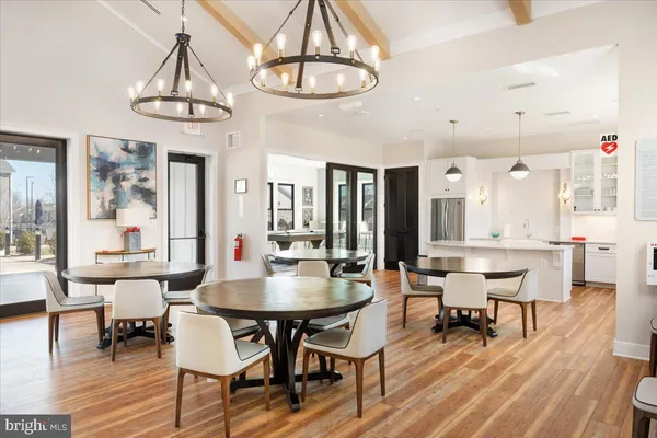 a large kitchen with kitchen island a large window