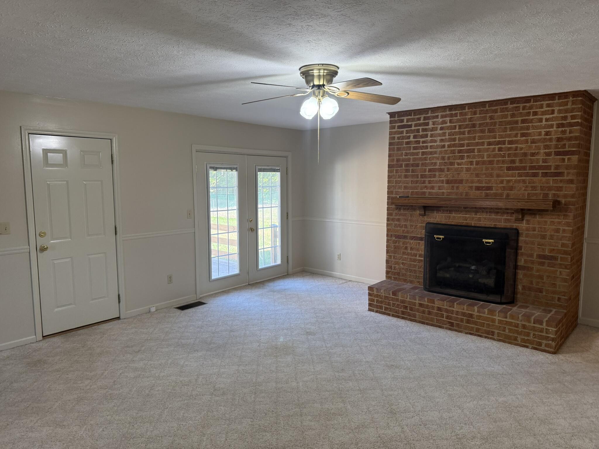 200 Sherry May Street Covington, VA 24426 - Photo 22 of 57 a view of an empty room with a fireplace