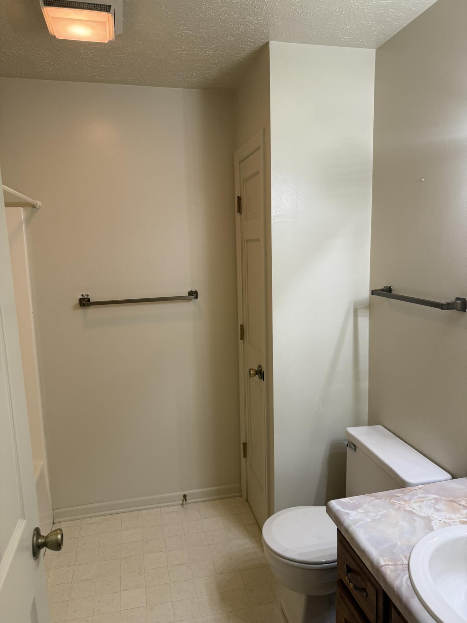 200 Sherry May Street Covington, VA 24426 - Photo 31 of 57 a bathroom with a granite countertop toilet and a sink