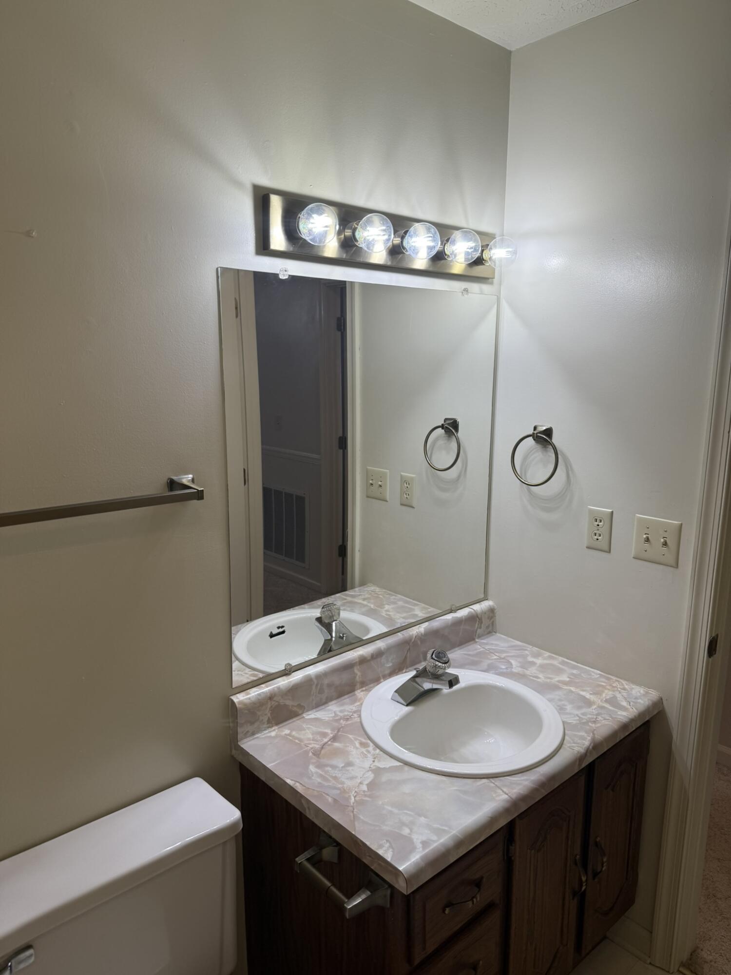 200 Sherry May Street Covington, VA 24426 - Photo 32 of 57 a bathroom with a sink and a mirror