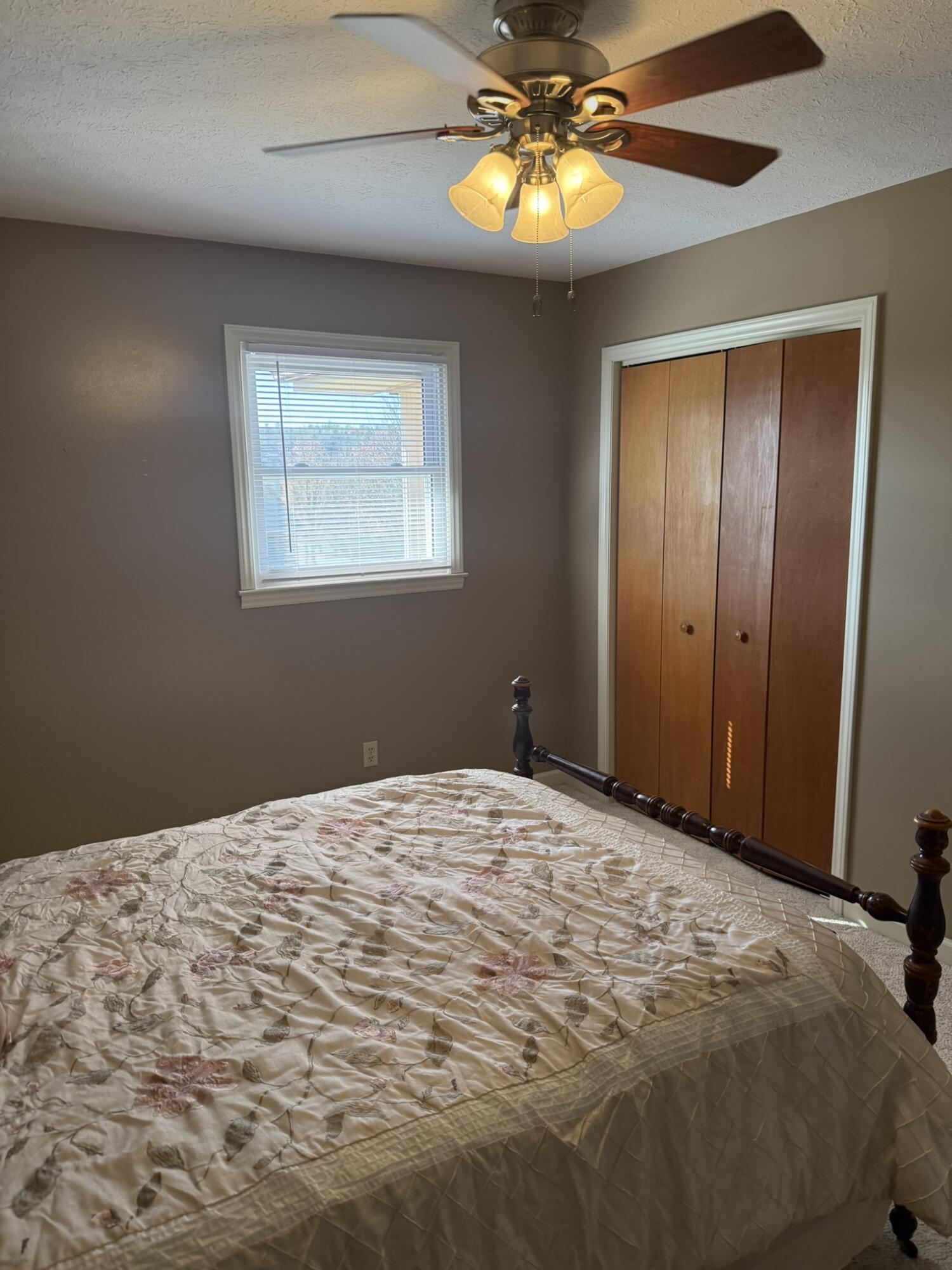 200 Sherry May Street Covington, VA 24426 - Photo 33 of 57 a bedroom with a bed and a chandelier