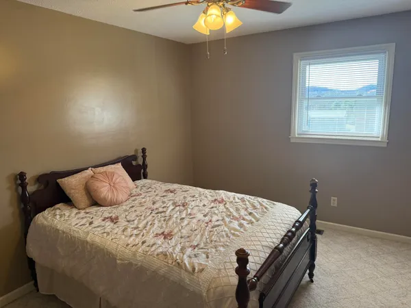 an empty room with a empty space and windows