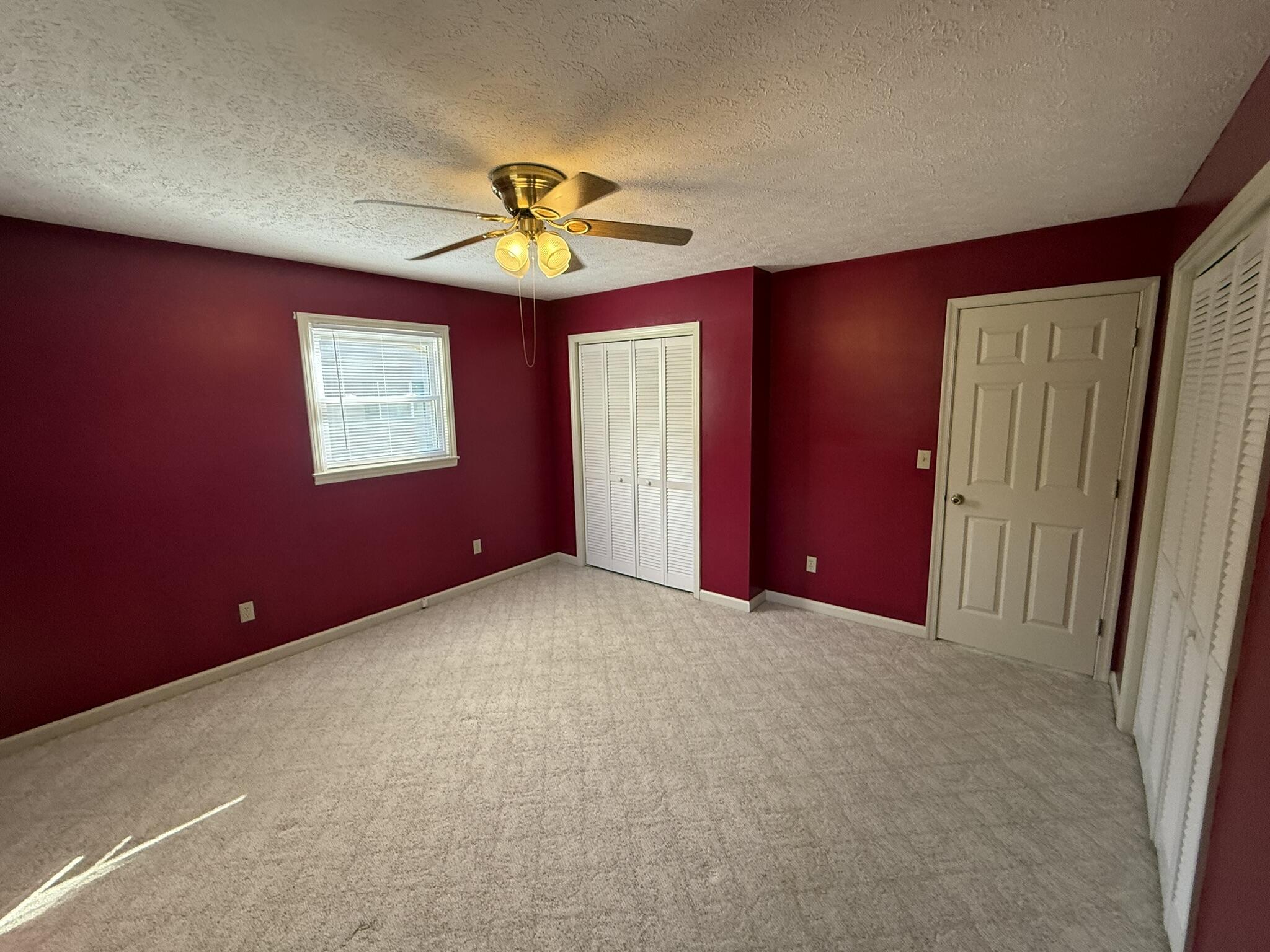 200 Sherry May Street Covington, VA 24426 - Photo 40 of 57 an empty room with windows and a chandelier fan