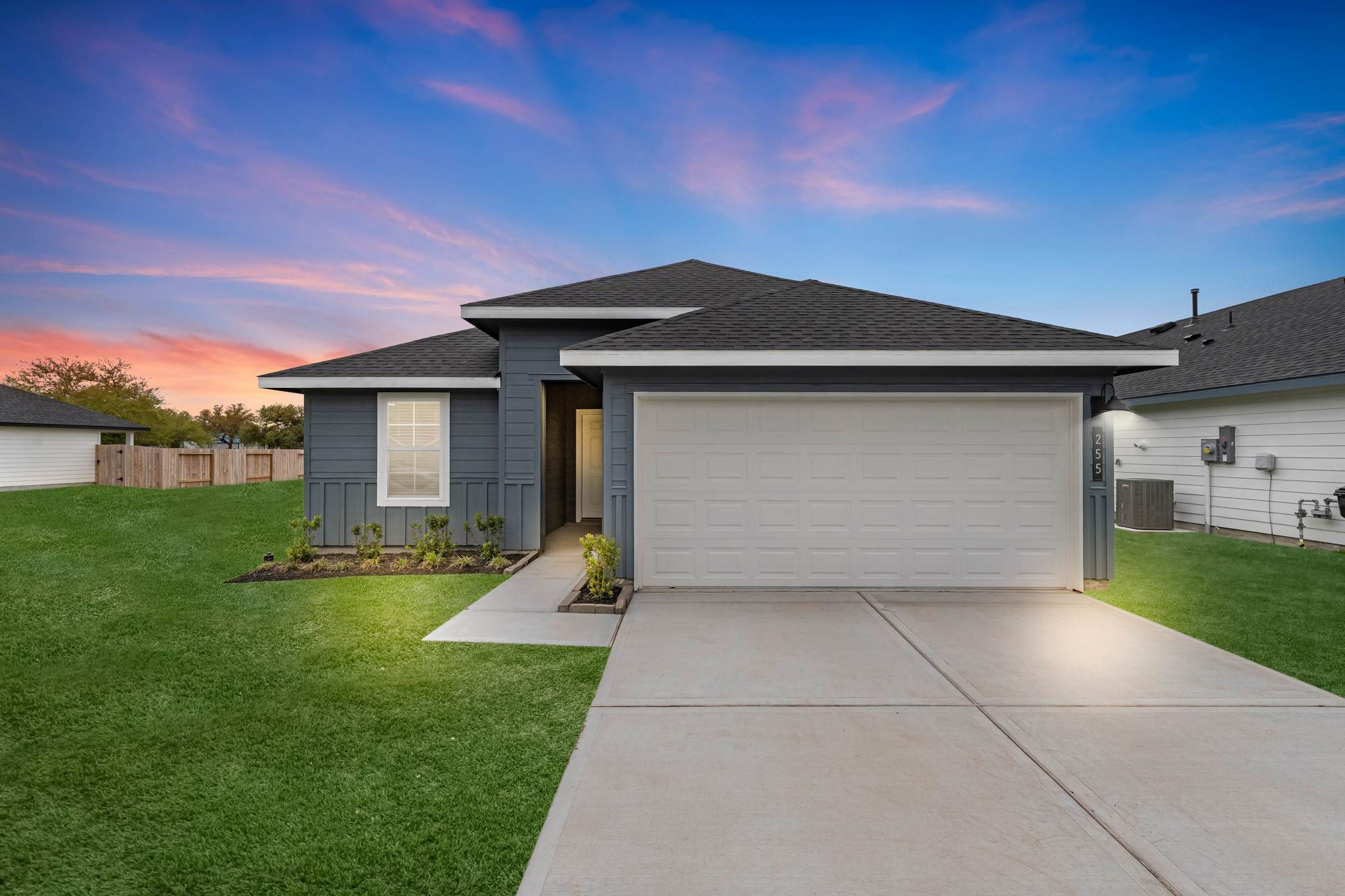 a front view of a house with a yard