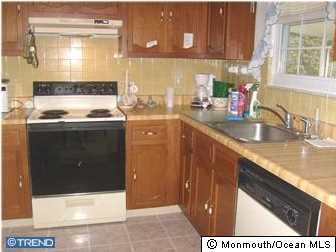 133B Sunset Road, Unit B Whiting, NJ 08759 - Photo 1 of 8 a kitchen with a sink and a stove
