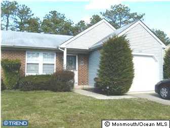 133B Sunset Road, Unit B Whiting, NJ 08759 - Photo 7 of 8 a view of a house with a yard