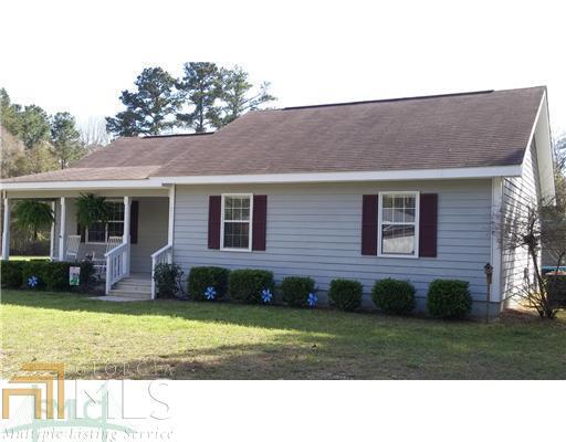 121 Laberta Drive, Unit 23 Springfield, GA 31329 - Photo 1 of 1 a black and white house with a yard
