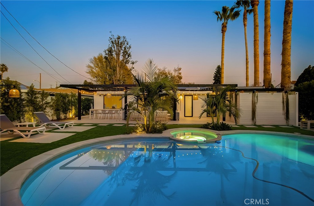 8161 Encino Avenue Northridge, CA 91325 - Photo 12 of 72 a view of a swimming pool with a patio