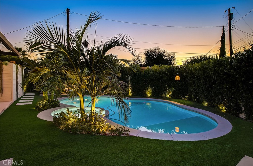 8161 Encino Avenue Northridge, CA 91325 - Photo 14 of 72 a view of a swimming pool with a yard