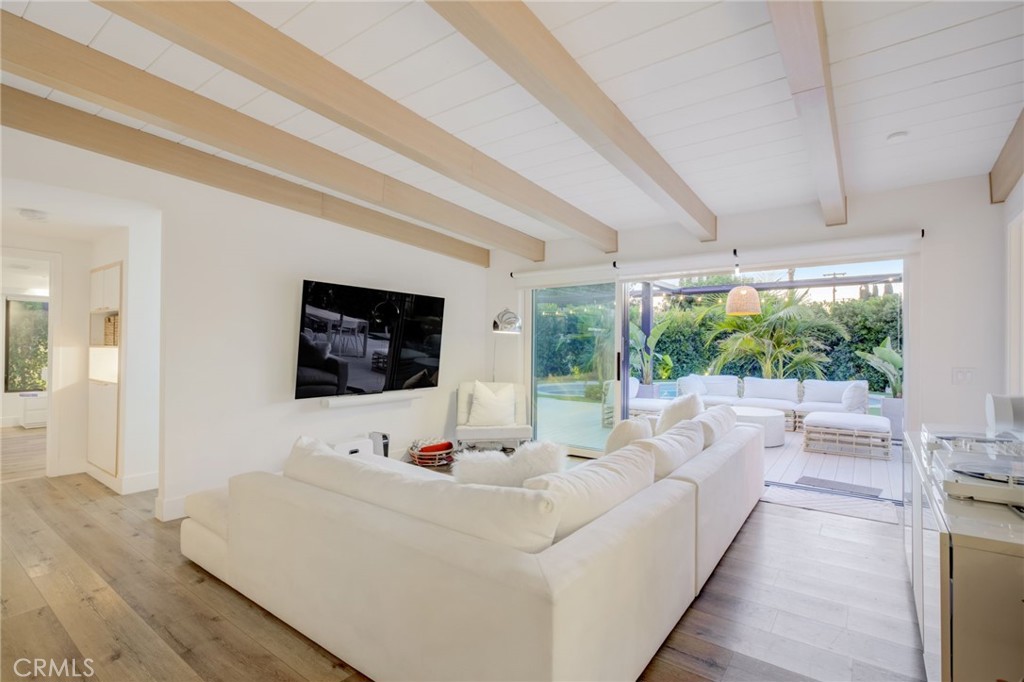 8161 Encino Avenue Northridge, CA 91325 - Photo 26 of 72 a living room with furniture and a flat screen tv
