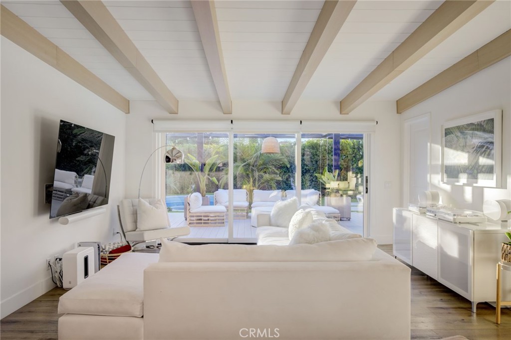 8161 Encino Avenue Northridge, CA 91325 - Photo 27 of 72 a living room with furniture and a flat screen tv