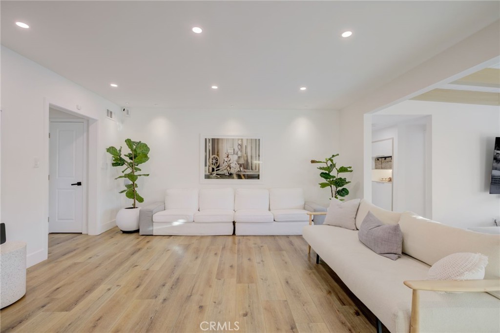 8161 Encino Avenue Northridge, CA 91325 - Photo 29 of 72 a living room with furniture and a potted plant