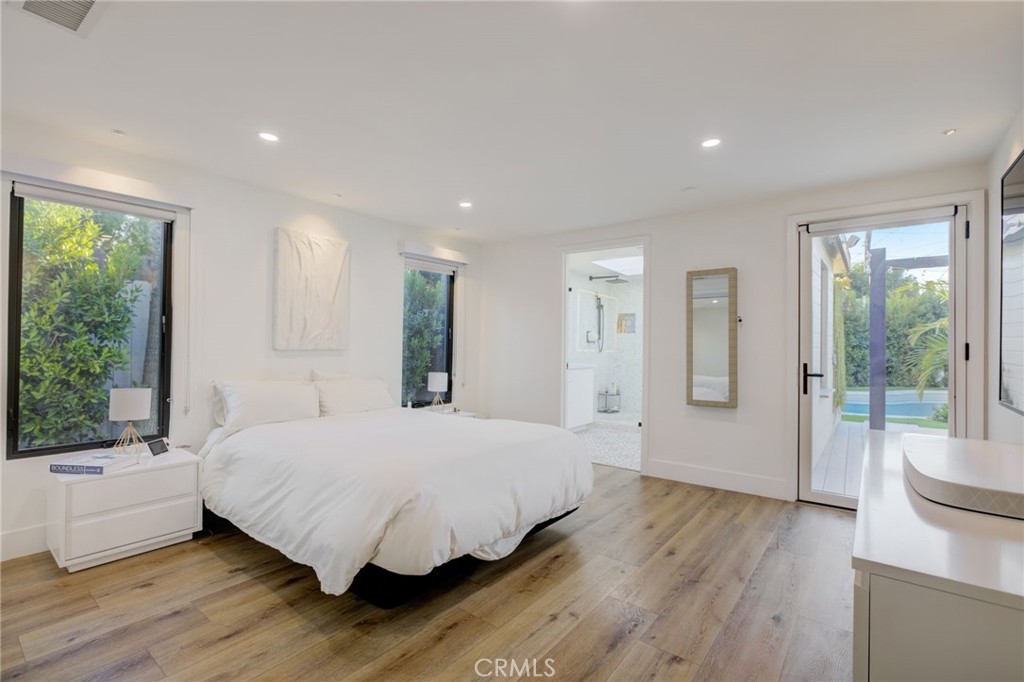 8161 Encino Avenue Northridge, CA 91325 - Photo 42 of 72 a bedroom with a large bed and a large window