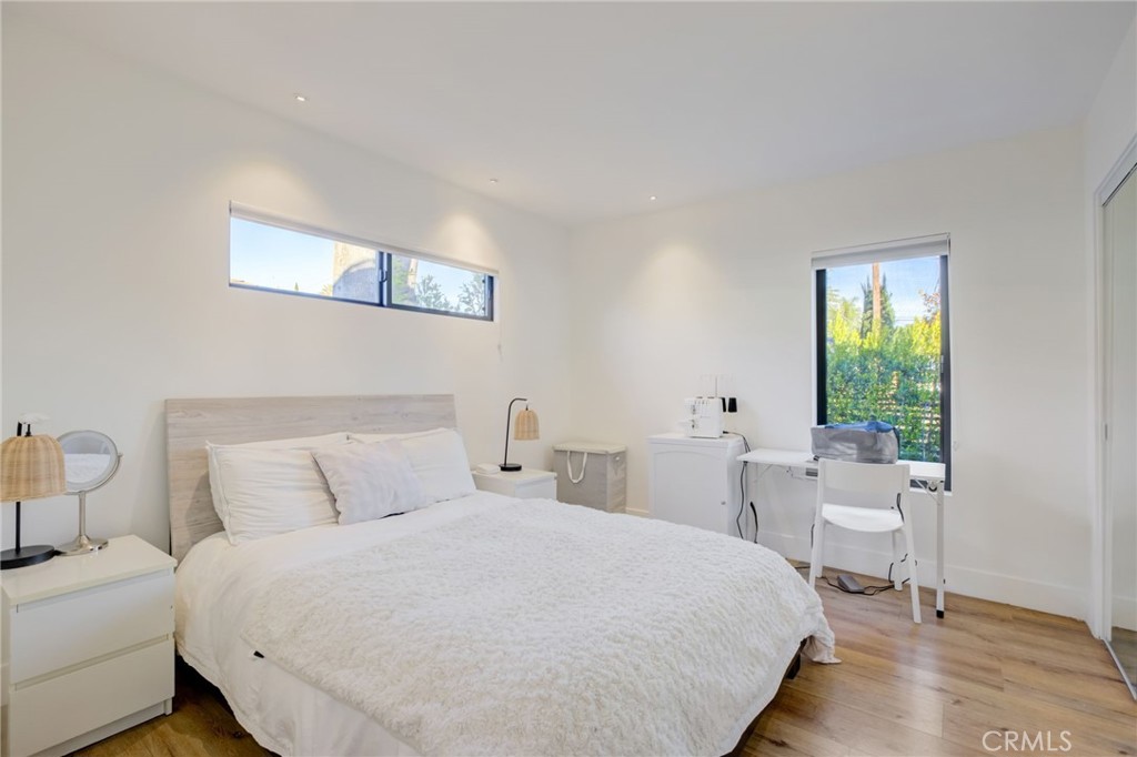 8161 Encino Avenue Northridge, CA 91325 - Photo 46 of 72 a bedroom with a bed and a table