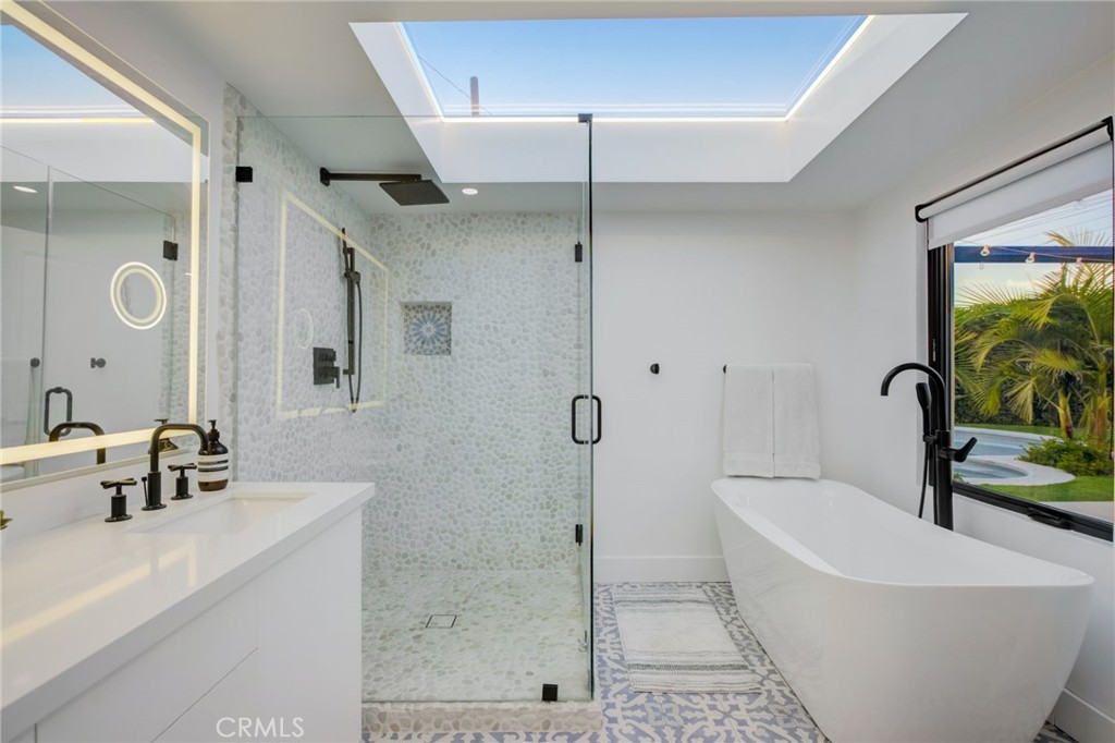 8161 Encino Avenue Northridge, CA 91325 - Photo 49 of 72 a bathroom with a bathtub and a sink