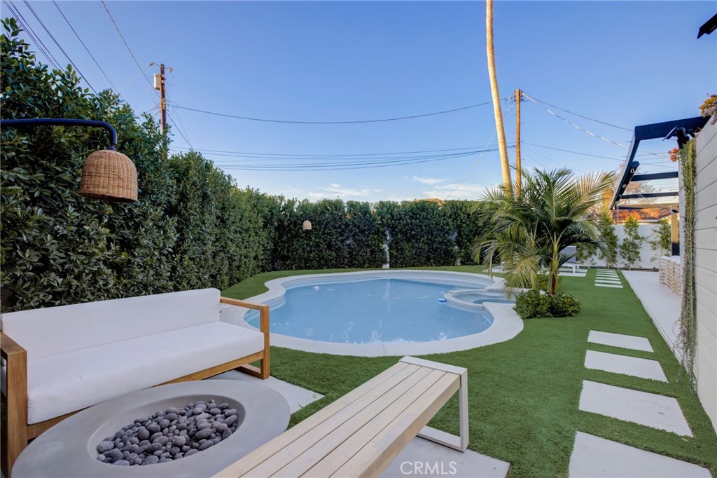 8161 Encino Avenue Northridge, CA 91325 - Photo 56 of 72 a view of yard with seating area and green space