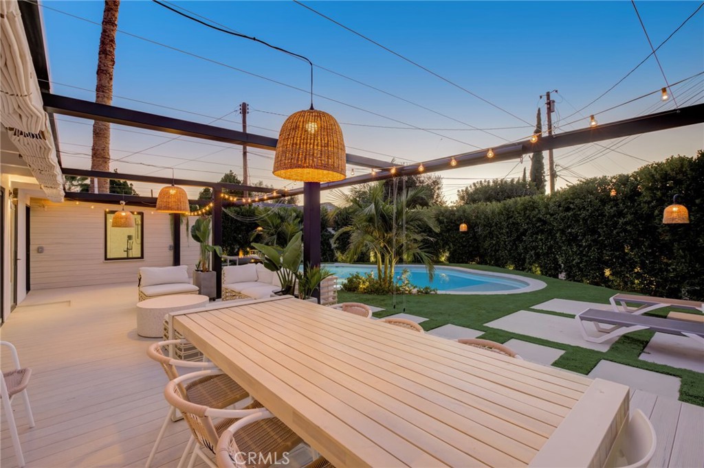 8161 Encino Avenue Northridge, CA 91325 - Photo 65 of 72 a view of a patio with a table and chairs