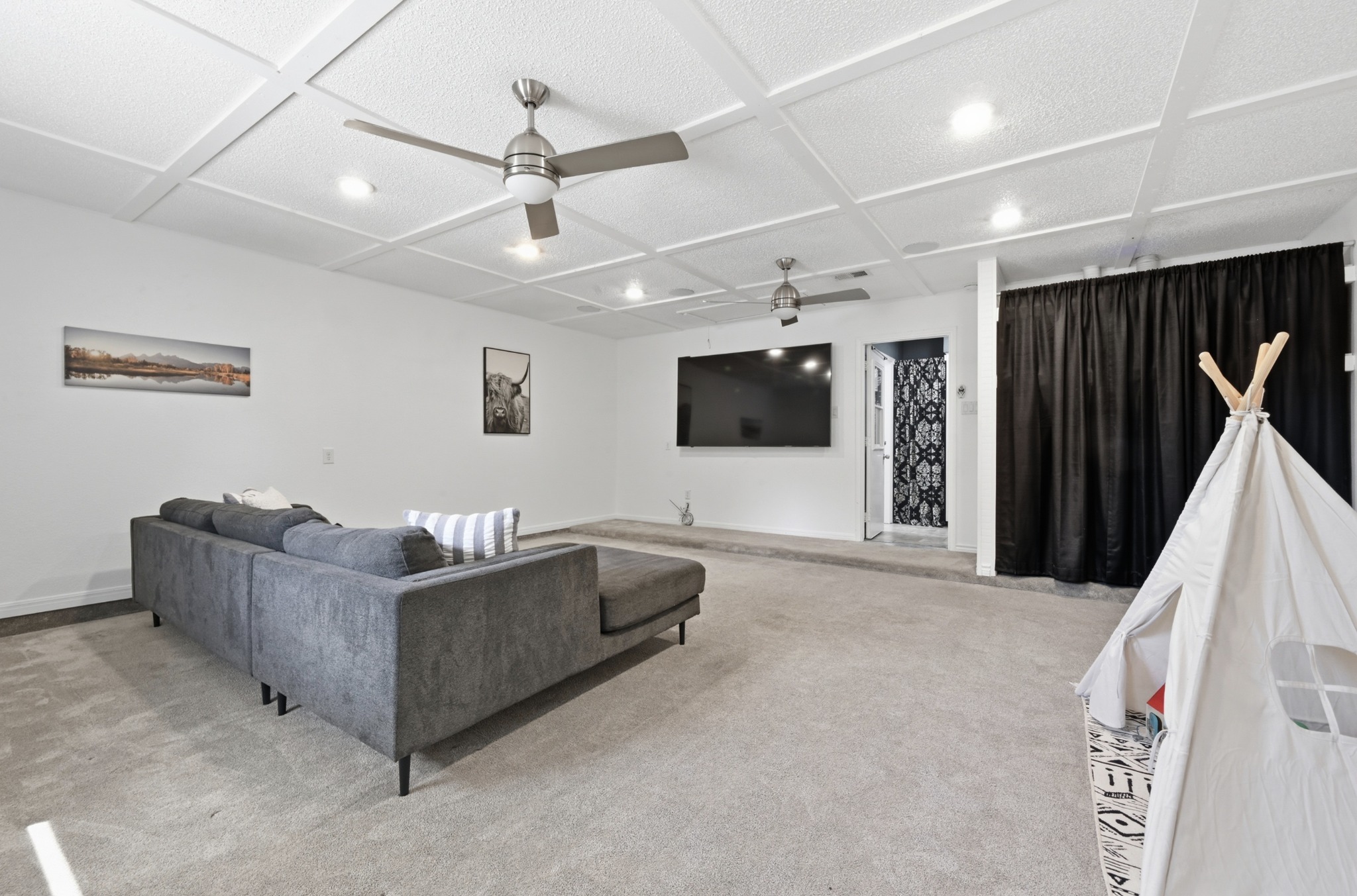 303 Pin Oak Drive Georgetown, TX 78628 - Photo 18 of 36 a living room with furniture and a flat screen tv