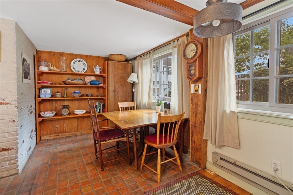 16 Pine Street Gloucester, MA 01930 - Photo 13 of 42 a view of a dining room with furniture window and outside view