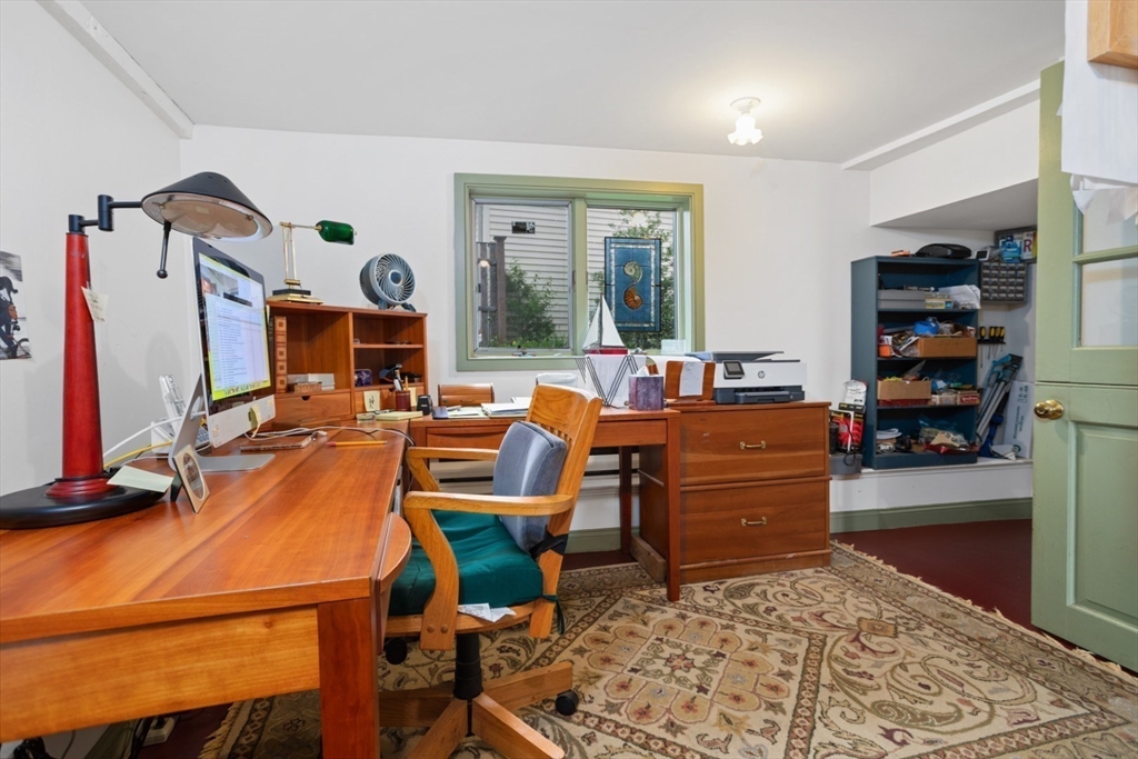 16 Pine Street Gloucester, MA 01930 - Photo 16 of 42 a room with furniture and a flat screen tv