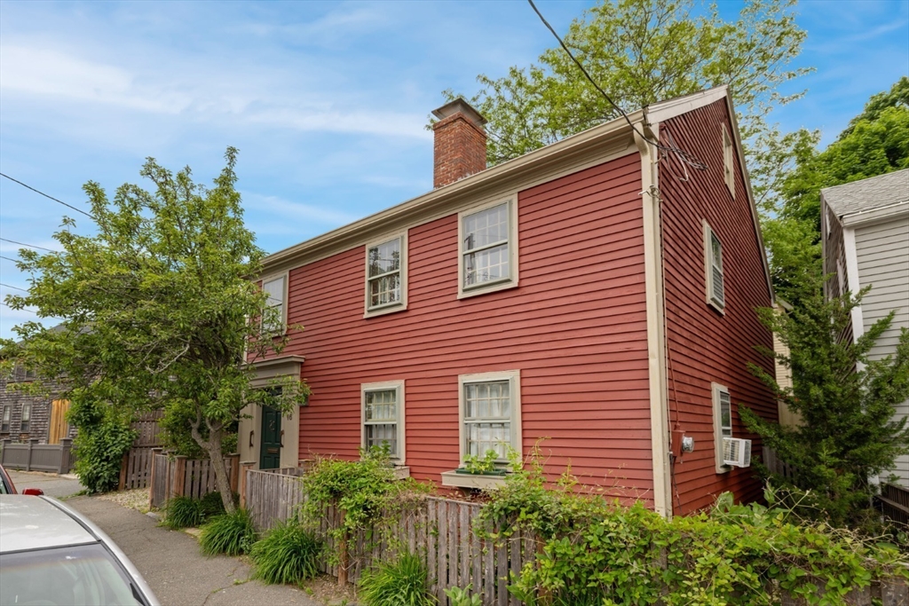 16 Pine Street Gloucester, MA 01930 - Photo 2 of 42 a front view of a house with plants