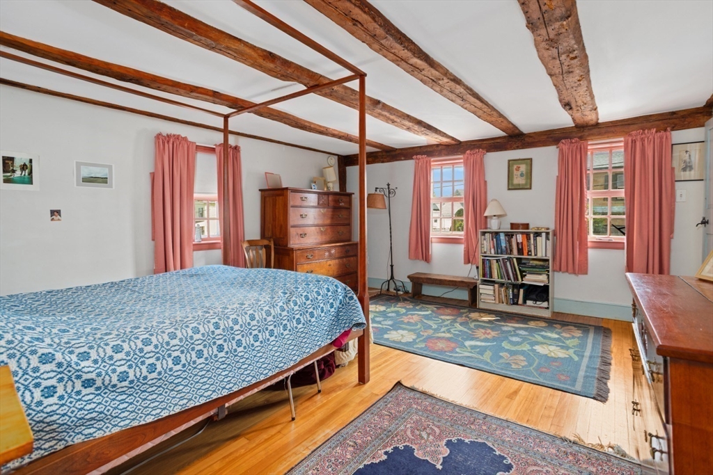 16 Pine Street Gloucester, MA 01930 - Photo 21 of 42 a bedroom with a bed and large windows