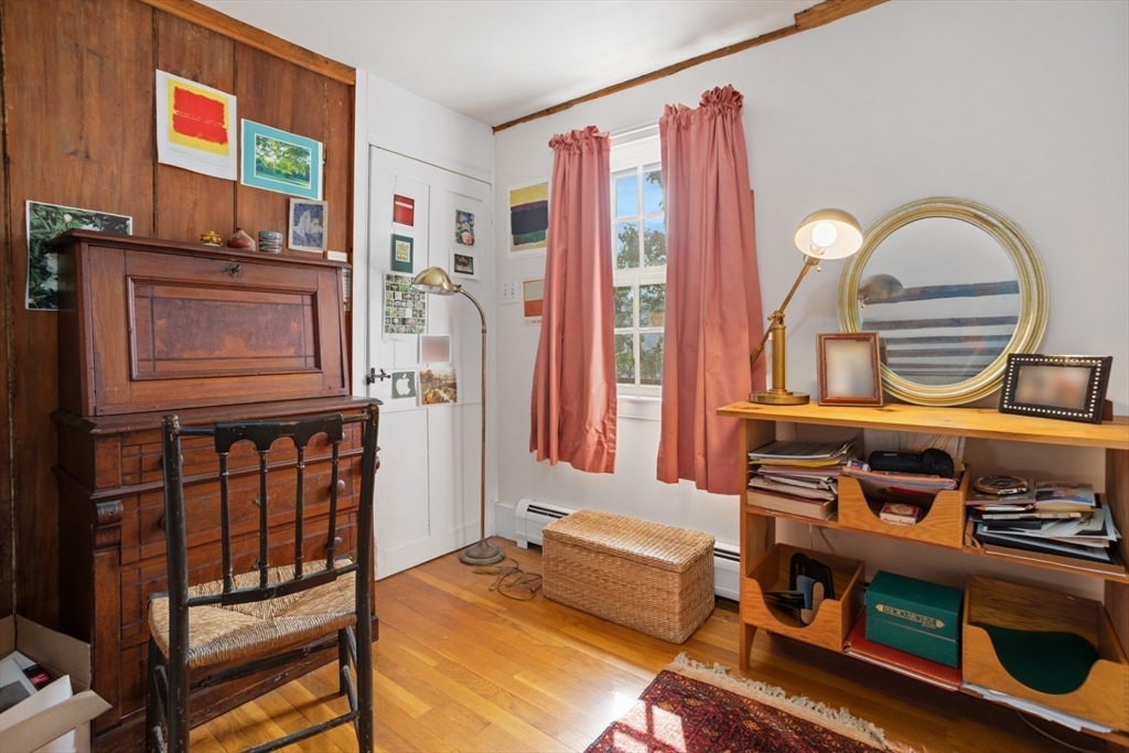 16 Pine Street Gloucester, MA 01930 - Photo 23 of 42 a living room with furniture a flat screen tv and a window