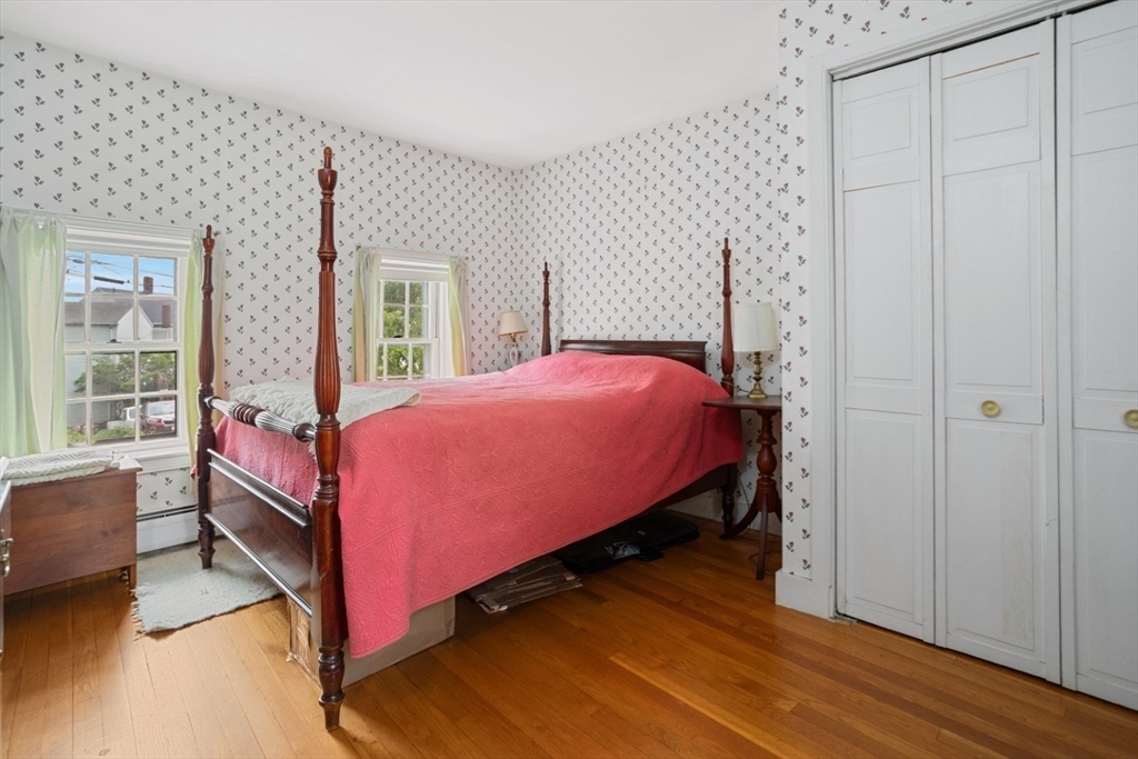 16 Pine Street Gloucester, MA 01930 - Photo 27 of 42 a bedroom with a bed and a window