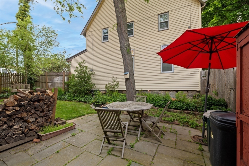 16 Pine Street Gloucester, MA 01930 - Photo 38 of 42 a view of a backyard with furniture and a garden