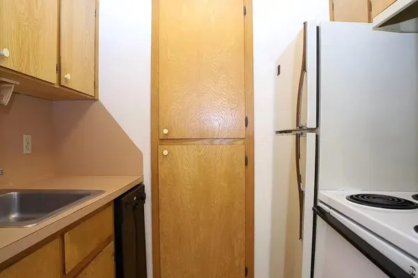 a view of a kitchen with a sink