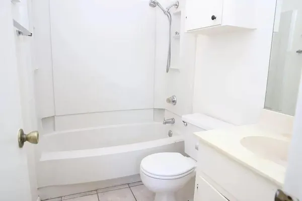 a bathroom with a sink a toilet and a bathtub