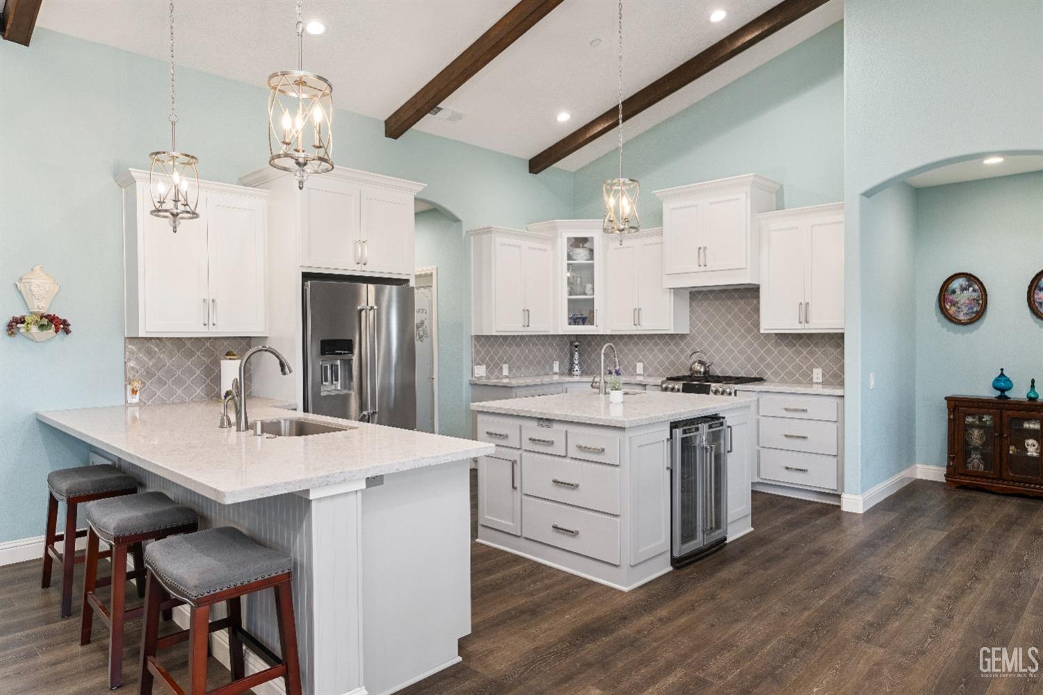 Undisclosed Address Tehachapi, CA 93561 - Photo 13 of 43 a kitchen with stainless steel appliances kitchen island granite countertop a sink cabinets and wooden floor