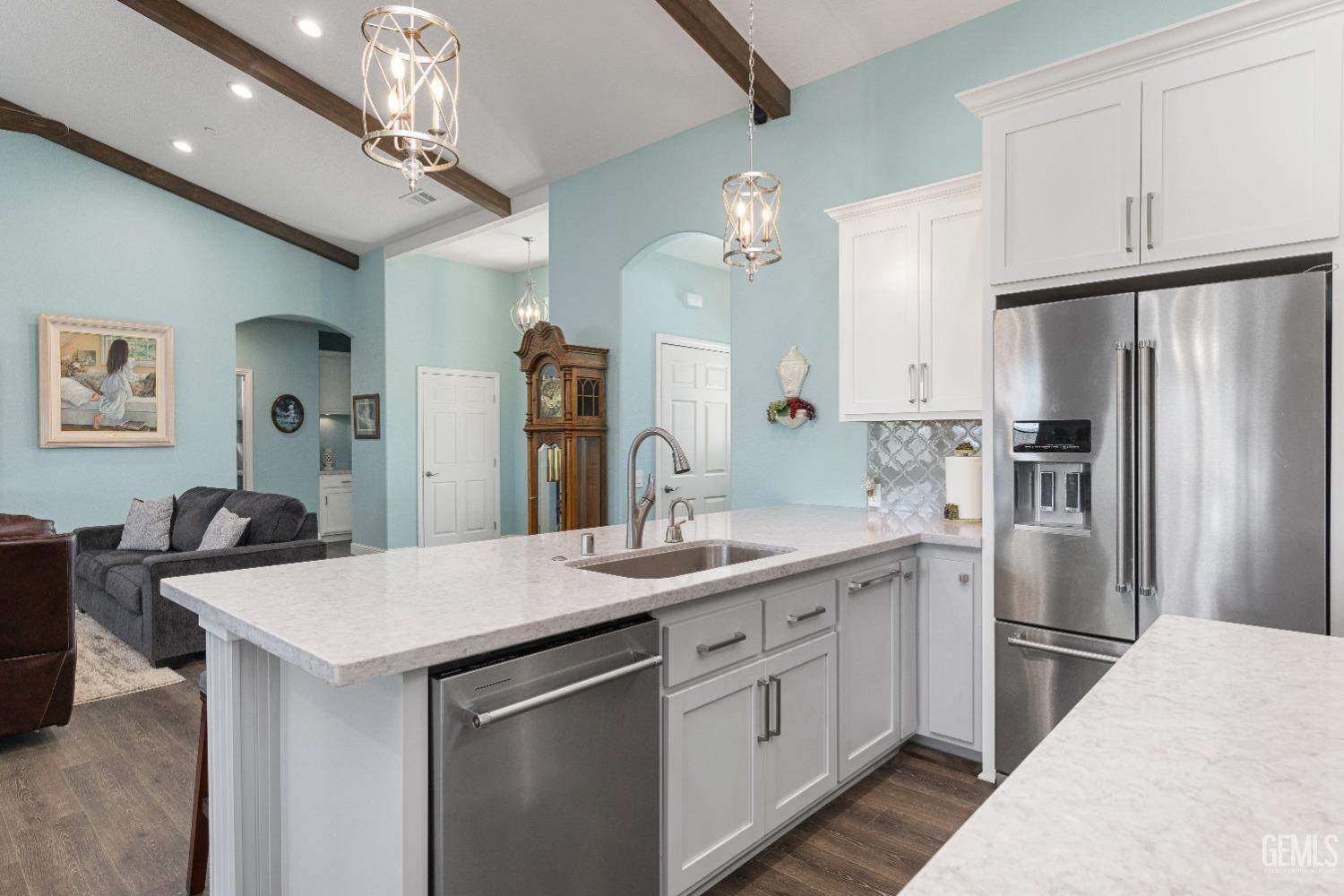 Undisclosed Address Tehachapi, CA 93561 - Photo 18 of 43 a kitchen with a sink stainless steel appliances a chandelier and kitchen view