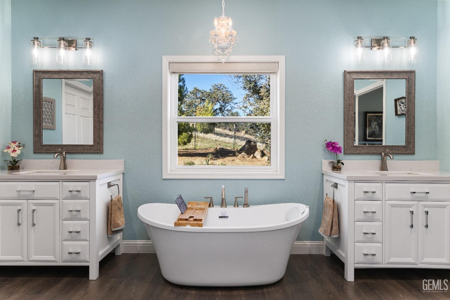 Undisclosed Address Tehachapi, CA 93561 - Photo 27 of 43 a bathroom with a tub sink and mirror
