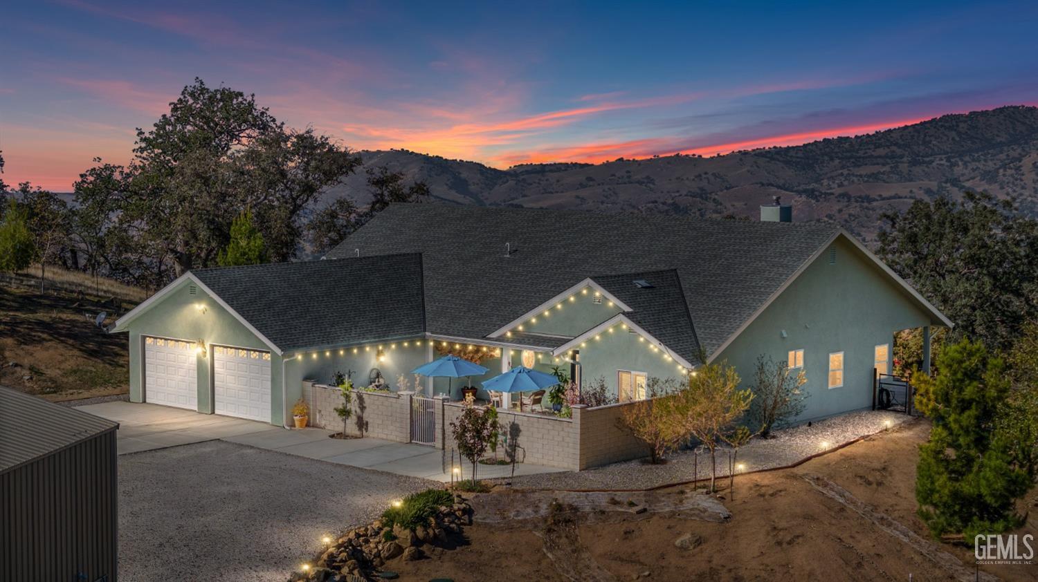 Undisclosed Address Tehachapi, CA 93561 - Photo 3 of 43 a view of a town with large trees and plants