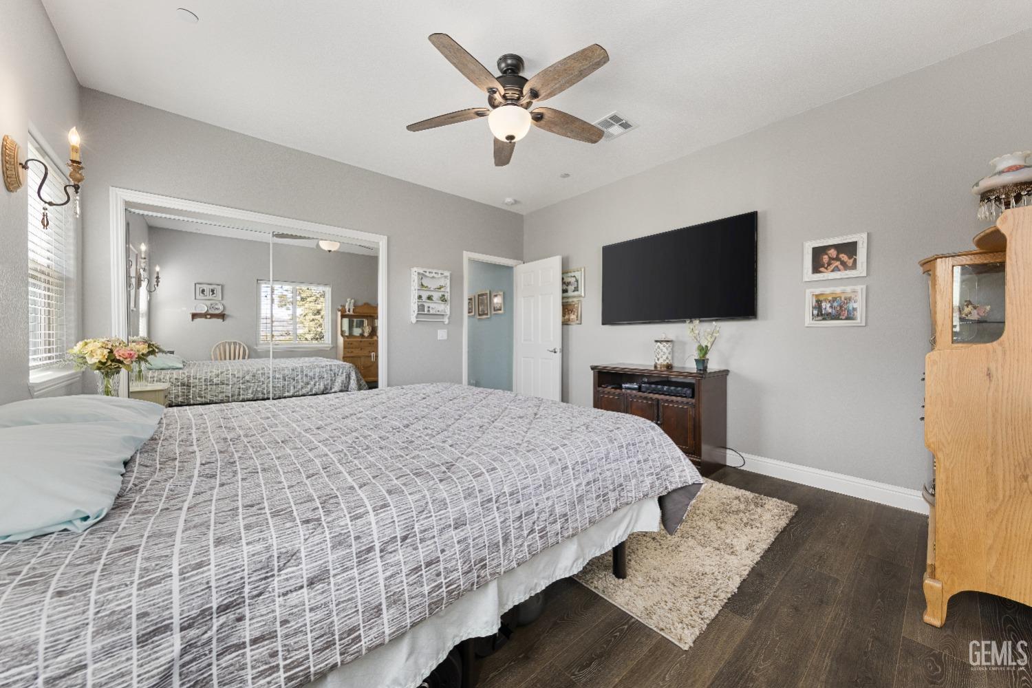 Undisclosed Address Tehachapi, CA 93561 - Photo 31 of 43 a spacious bedroom with a bed and a flat screen tv