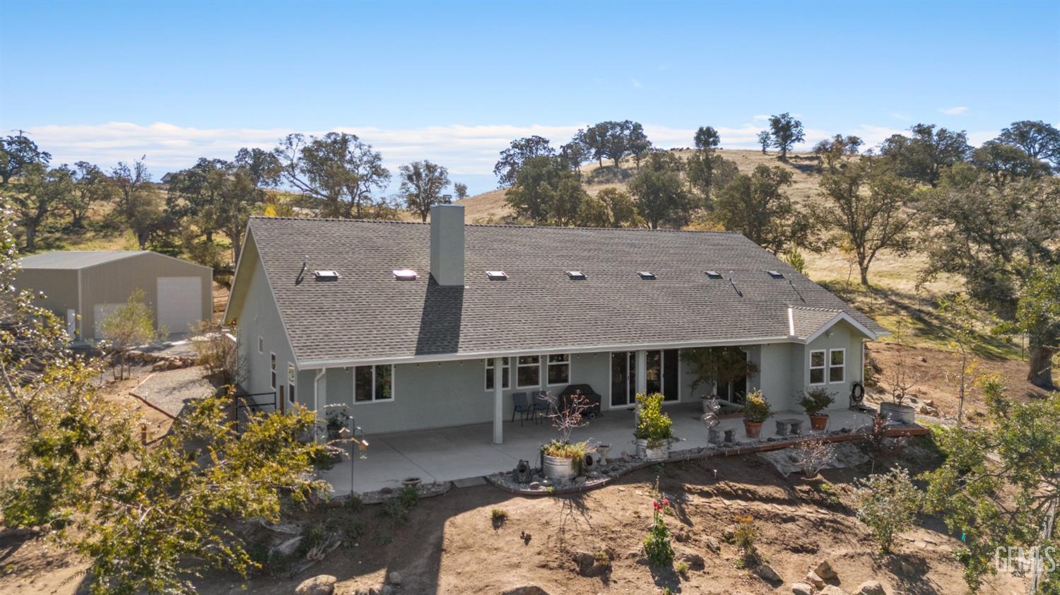 Undisclosed Address Tehachapi, CA 93561 - Photo 6 of 43 a view of a house with backyard and sitting area
