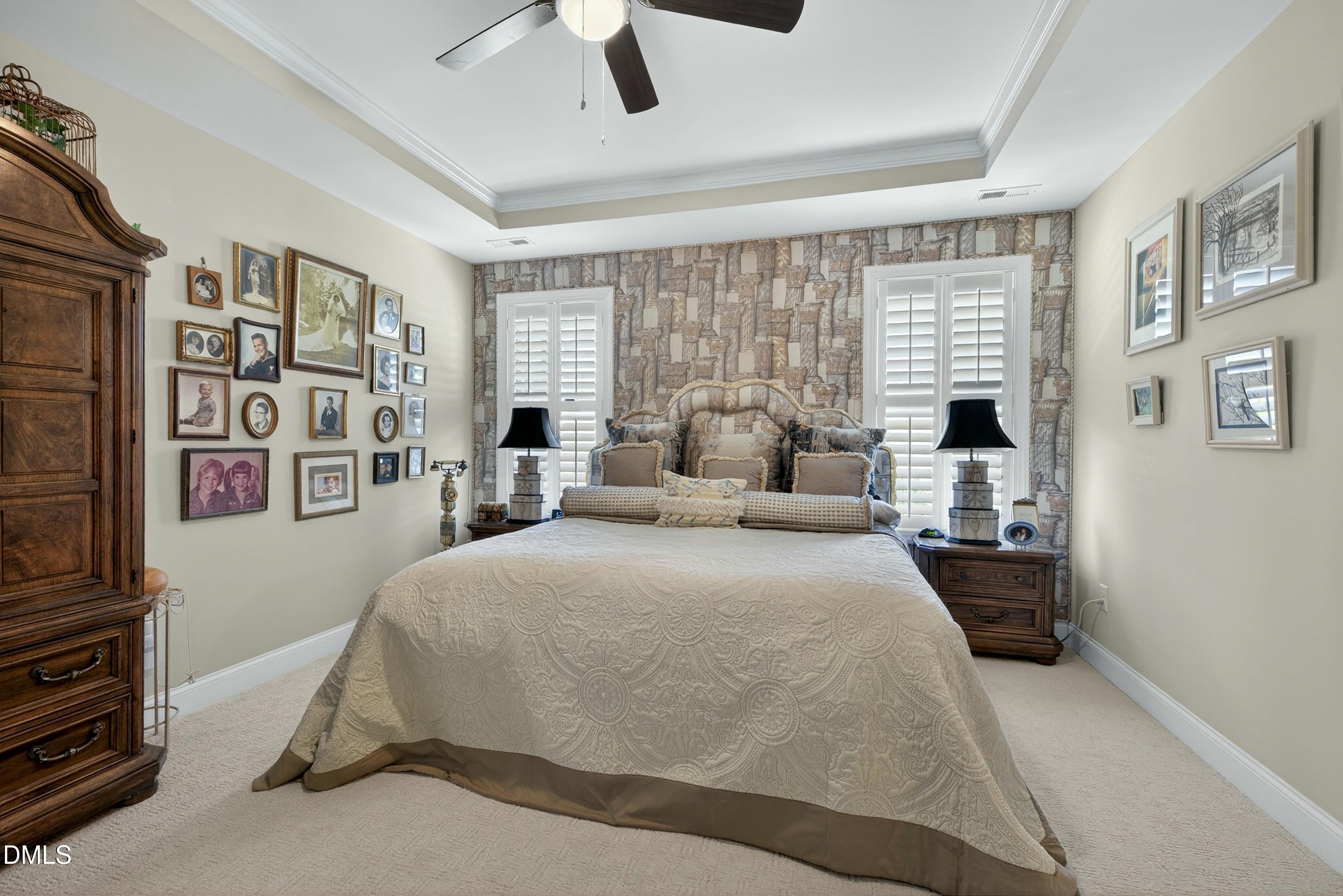 121 Telluride Trail Garner, NC 27529 - Photo 11 of 41 a spacious bedroom with a bed and a flat tv screen