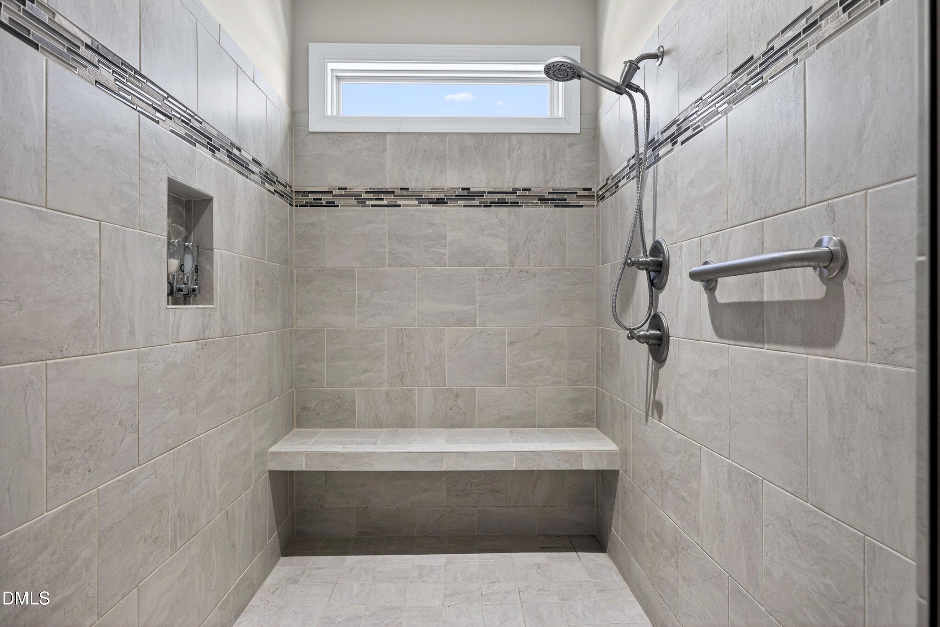 121 Telluride Trail Garner, NC 27529 - Photo 15 of 41 a bathroom with a shower and vanity