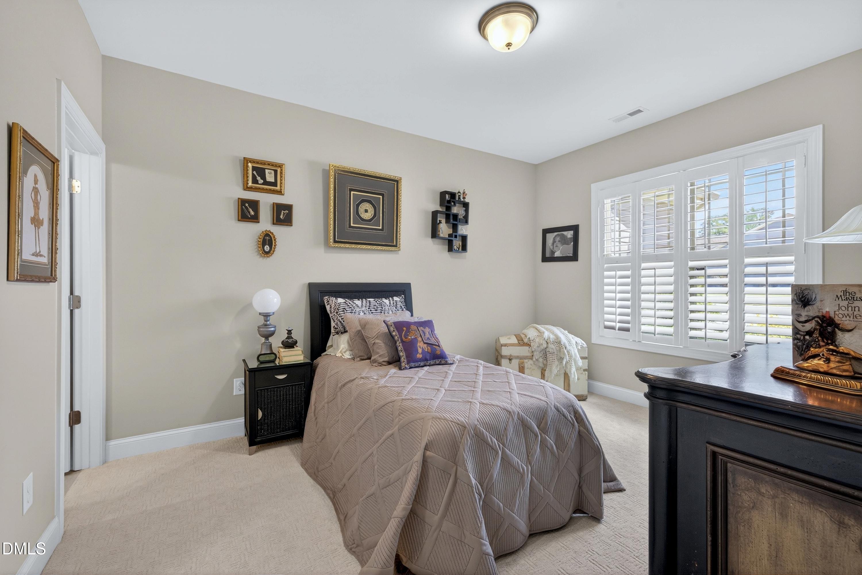 121 Telluride Trail Garner, NC 27529 - Photo 16 of 41 a bedroom with a bed and a window
