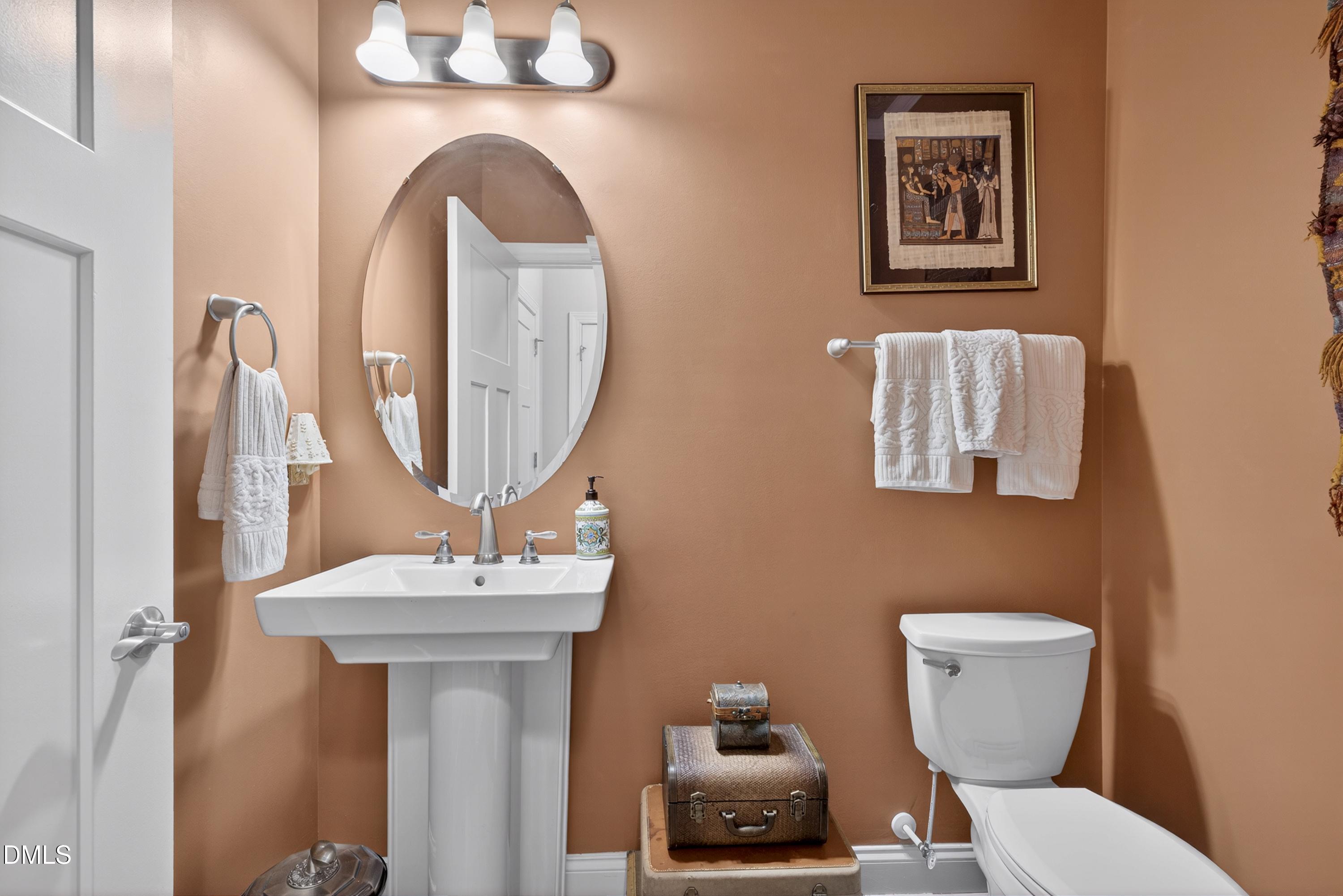 121 Telluride Trail Garner, NC 27529 - Photo 20 of 41 a bathroom with a toilet sink and mirror
