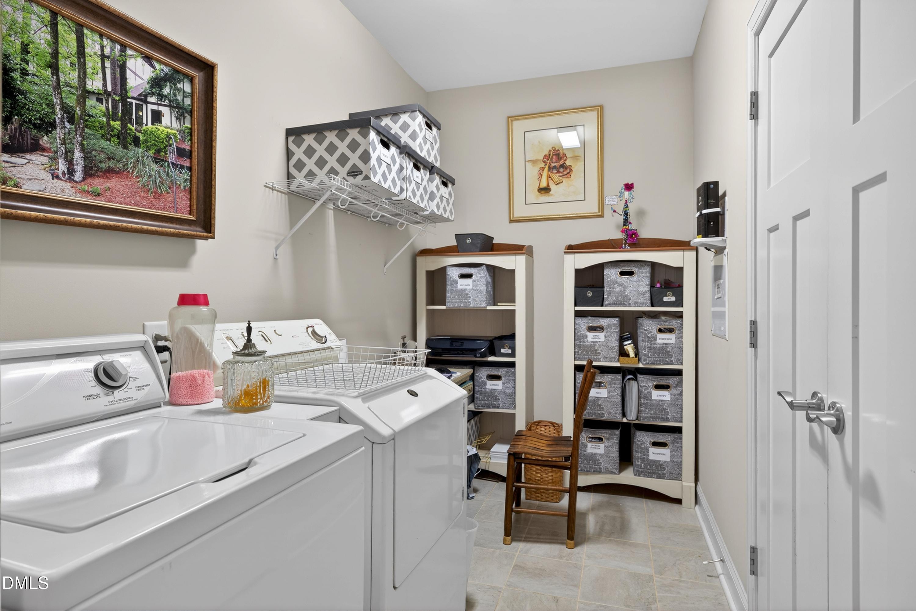 121 Telluride Trail Garner, NC 27529 - Photo 21 of 41 a storage room with washer and dryer