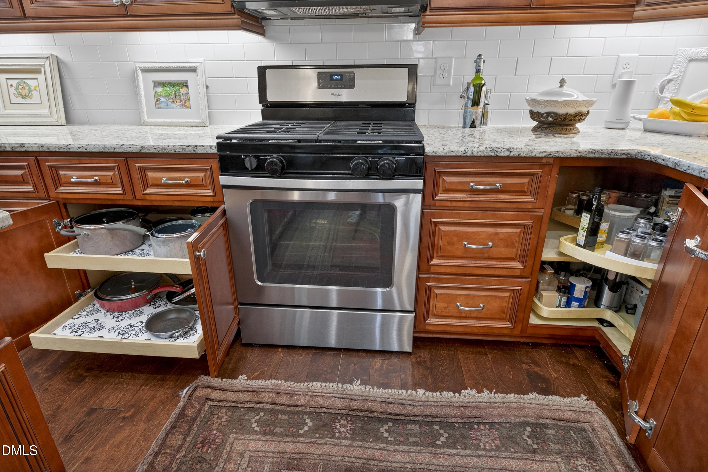 121 Telluride Trail Garner, NC 27529 - Photo 27 of 41 a kitchen with a stove and a wooden floor