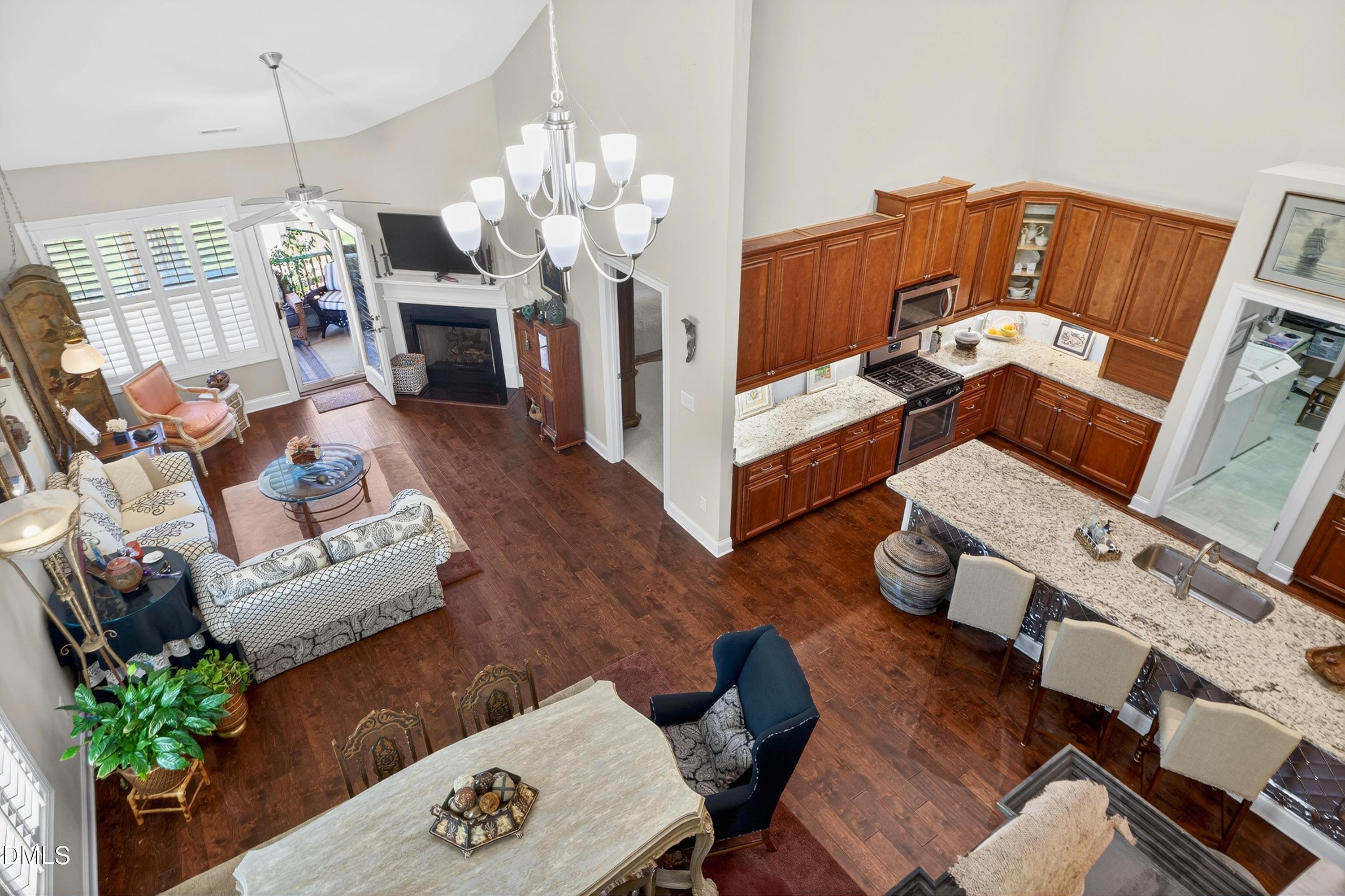 121 Telluride Trail Garner, NC 27529 - Photo 29 of 41 a view of a dining room with furniture a chandelier and wooden floor