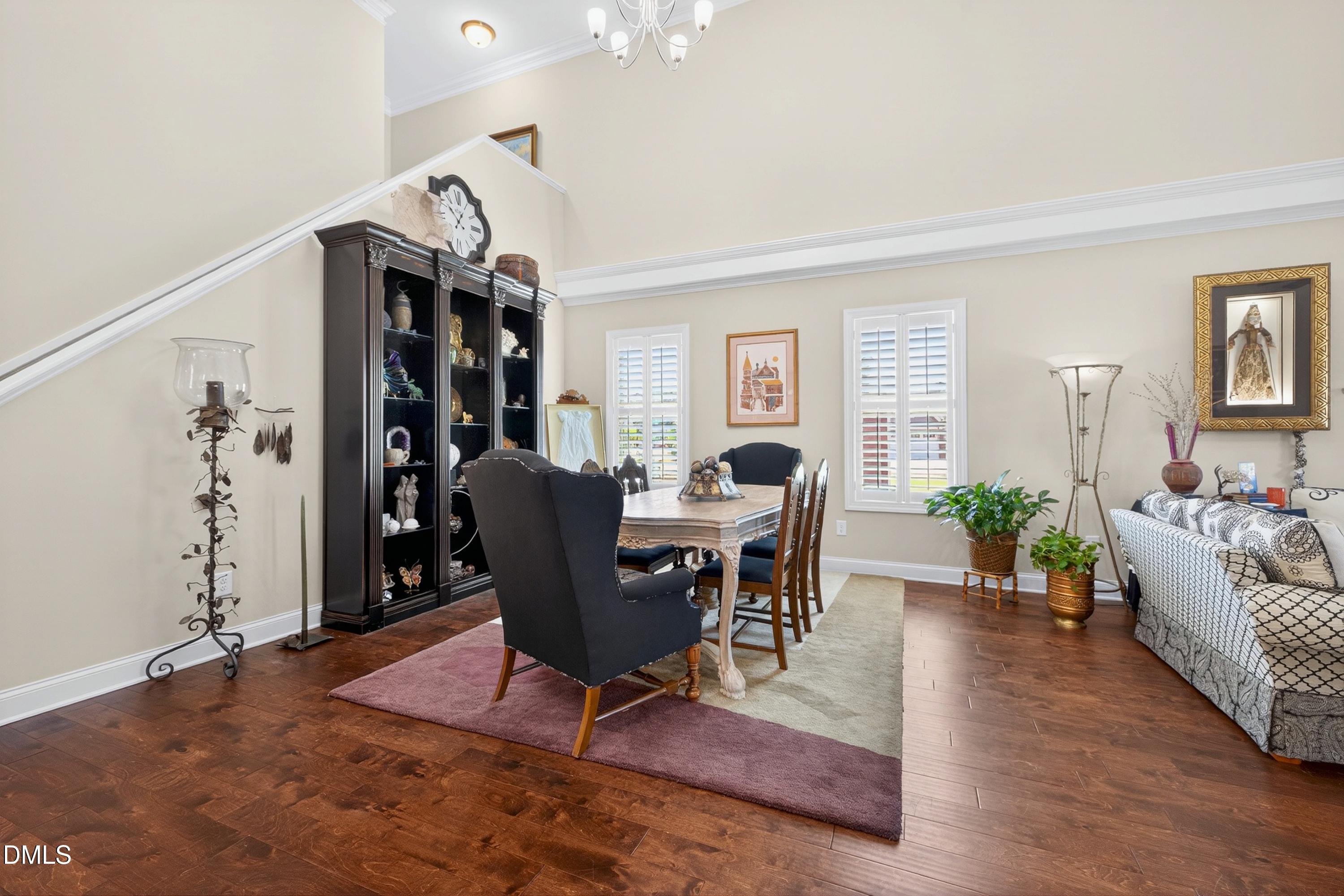 121 Telluride Trail Garner, NC 27529 - Photo 2 of 41 a living room with furniture a dining table and a potted plant